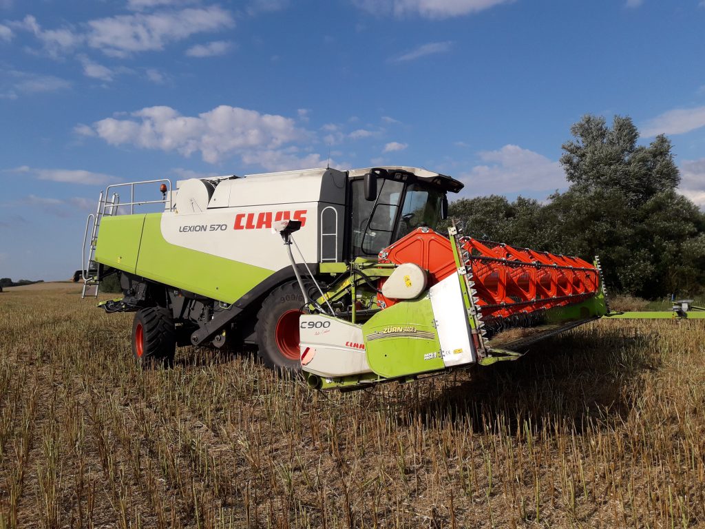 Lexion 570 Tröska med Zurn skärbordsförlängning på C900 skärbord